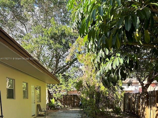 view of yard with a patio area and fence