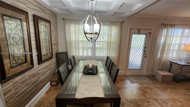 dining area with beamed ceiling, a notable chandelier, baseboards, and coffered ceiling