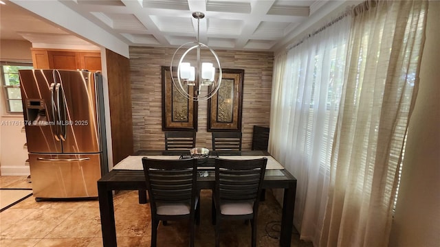 dining space featuring light tile patterned flooring, a notable chandelier, beamed ceiling, and coffered ceiling