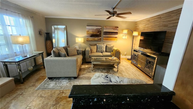 living room featuring a textured ceiling, a ceiling fan, and ornamental molding