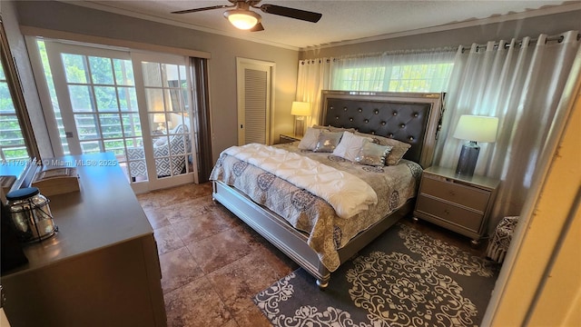 bedroom featuring a closet, multiple windows, ornamental molding, and a ceiling fan