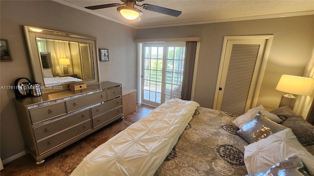 bedroom featuring a closet, a textured ceiling, ceiling fan, and ornamental molding