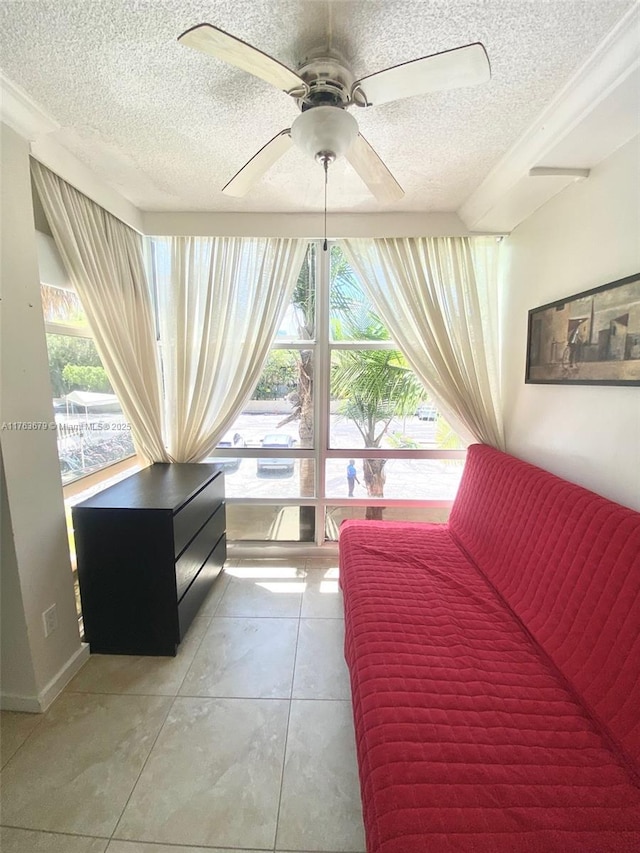 living room featuring a textured ceiling and ceiling fan