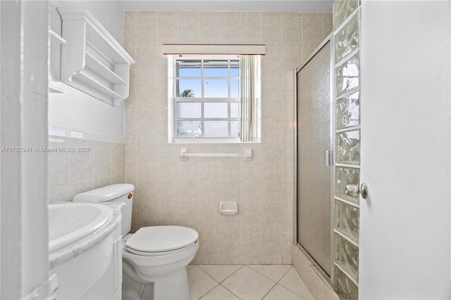 bathroom featuring an enclosed shower, toilet, tile walls, tile patterned flooring, and vanity