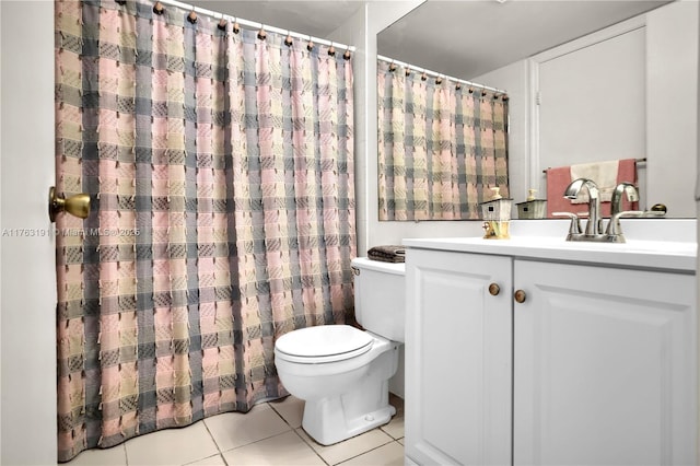 full bath with a shower with curtain, toilet, vanity, and tile patterned flooring