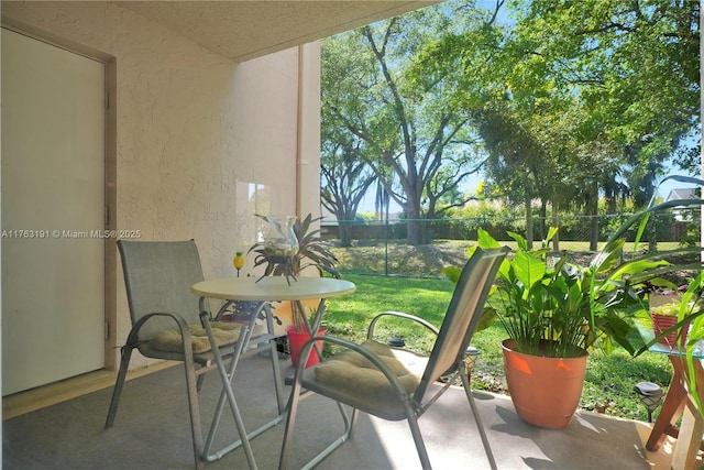 view of patio / terrace featuring fence