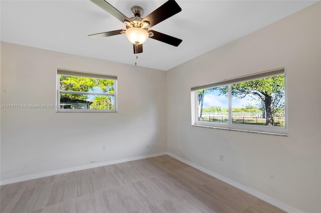 13390 SW 26th St, Davie, FL 33325 - empty room with healthy amount of natural light and a ceiling fan