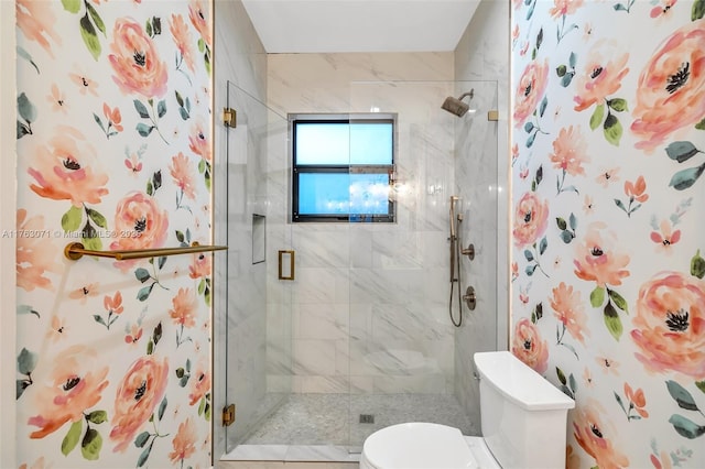 full bathroom featuring a stall shower and toilet