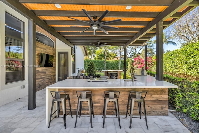 view of patio featuring a ceiling fan