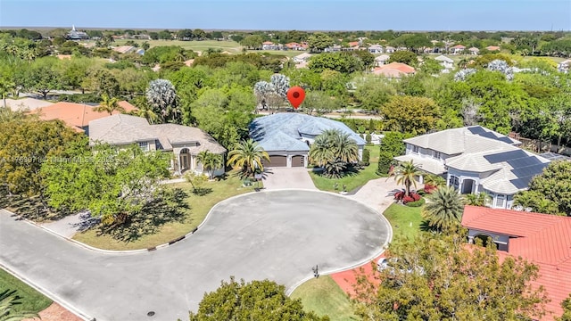 birds eye view of property with a residential view