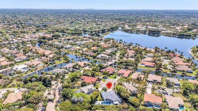 birds eye view of property featuring a residential view and a water view