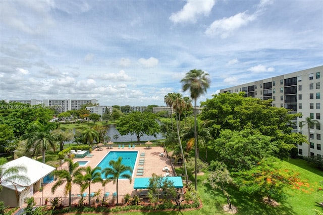 view of swimming pool featuring a city view