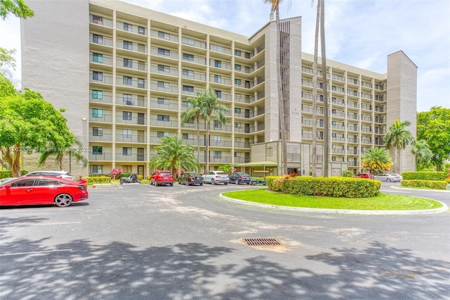 view of property featuring uncovered parking