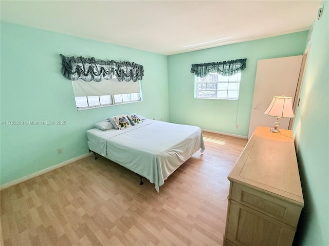 17202 SW 113th Ct Unit 21943A, Miami, FL 33157 - bedroom featuring light wood-type flooring and baseboards