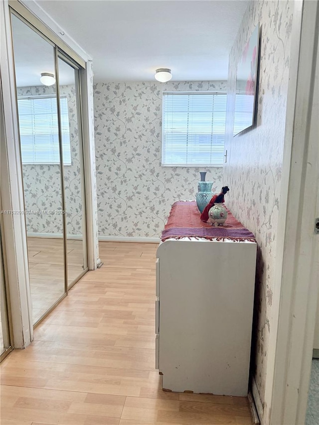 17202 SW 113th Ct Unit 21943A, Miami, FL 33157 - interior space with wallpapered walls, a healthy amount of sunlight, and light wood-type flooring