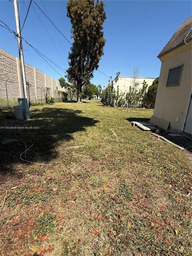 view of yard with fence