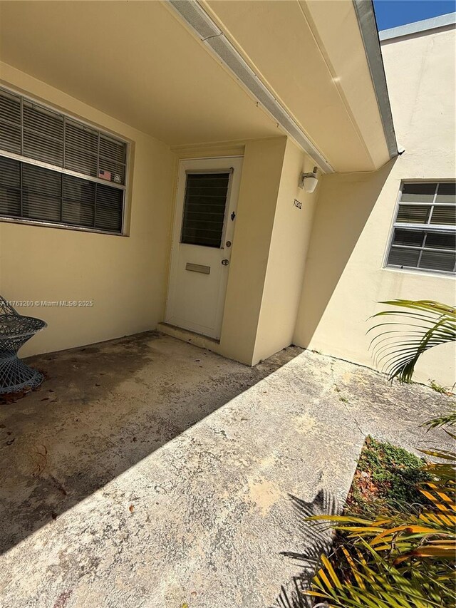 17202 SW 113th Ct Unit 21943A, Miami, FL 33157 - entrance to property featuring a patio area and stucco siding