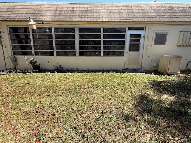 17202 SW 113th Ct Unit 21943A, Miami, FL 33157 - back of house featuring a lawn and roof with shingles