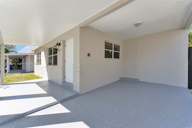 view of patio / terrace with a carport