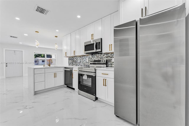 kitchen with visible vents, marble finish floor, tasteful backsplash, appliances with stainless steel finishes, and a peninsula