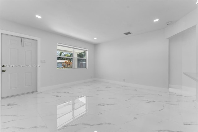 unfurnished room with recessed lighting, baseboards, visible vents, and marble finish floor