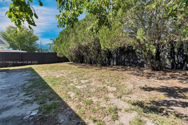 view of yard with a fenced backyard