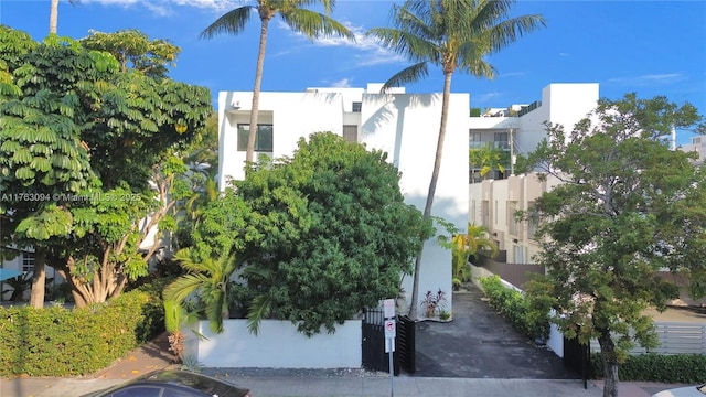 view of building exterior with fence