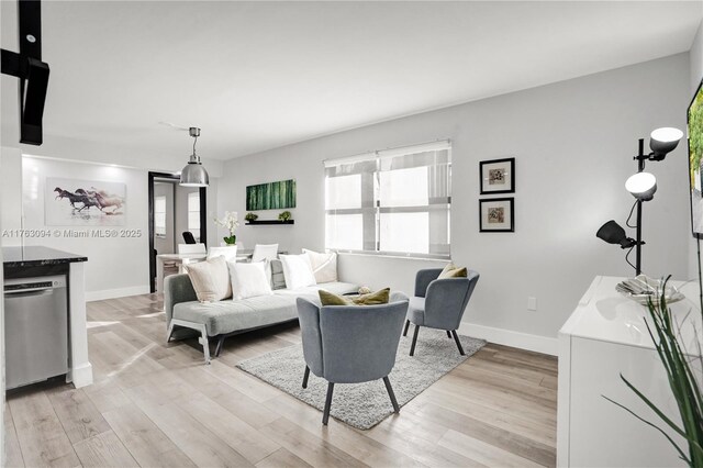 619 Euclid Ave Unit 1B, Miami Beach, FL 33139 - living area featuring light wood-style floors and baseboards