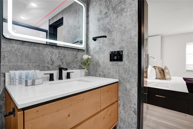 bathroom featuring vanity and ensuite bathroom