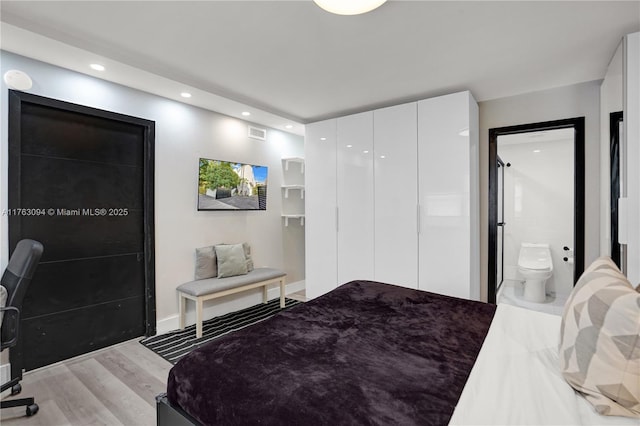 bedroom featuring light wood-style flooring, recessed lighting, and visible vents