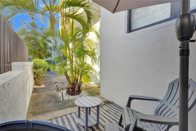 view of patio / terrace featuring fence