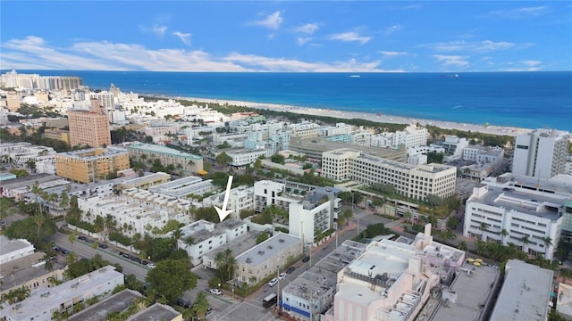 birds eye view of property featuring a view of city and a water view