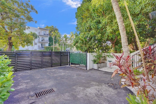 view of patio featuring fence and a gate