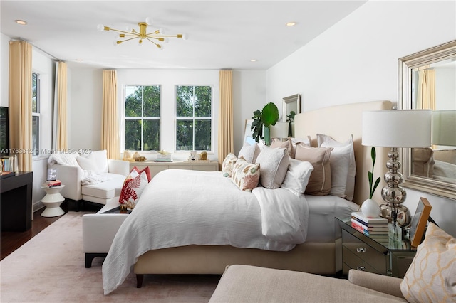 bedroom featuring wood finished floors and recessed lighting