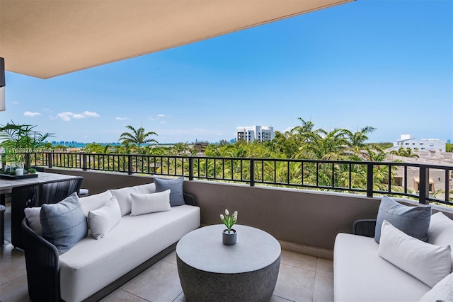 balcony with a city view and an outdoor living space