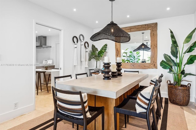 dining area featuring recessed lighting and baseboards