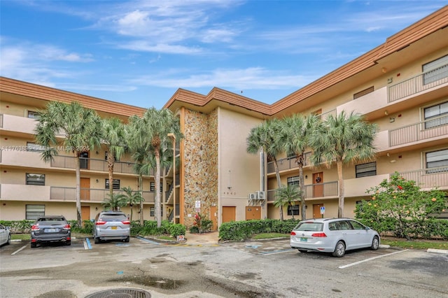 view of property featuring uncovered parking