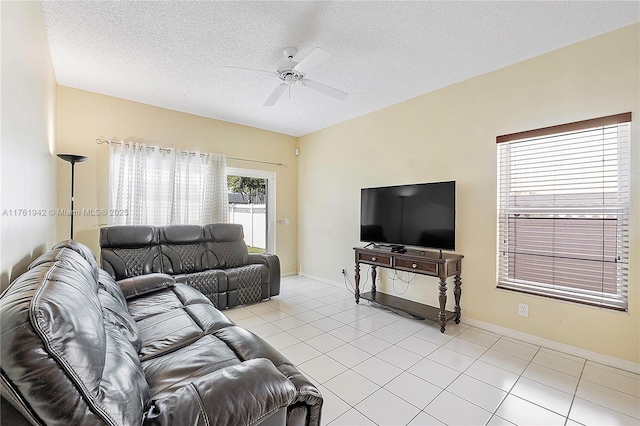 6244 NW 38th Dr, Coral Springs, FL 33067 - living area with a ceiling fan, light tile patterned floors, a textured ceiling, and baseboards