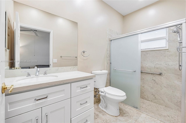 full bathroom featuring tile patterned floors, toilet, a stall shower, and vanity