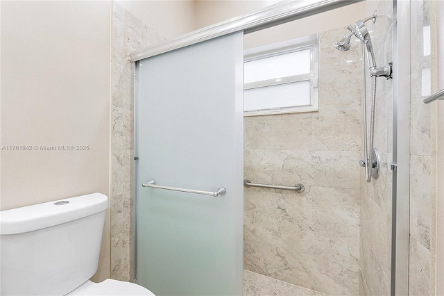 full bath with a shower stall and toilet