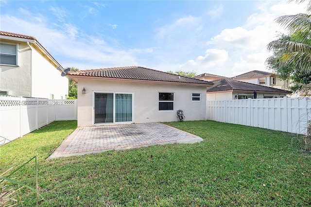 6244 NW 38th Dr, Coral Springs, FL 33067 - rear view of house featuring stucco siding, a tiled roof, and a patio