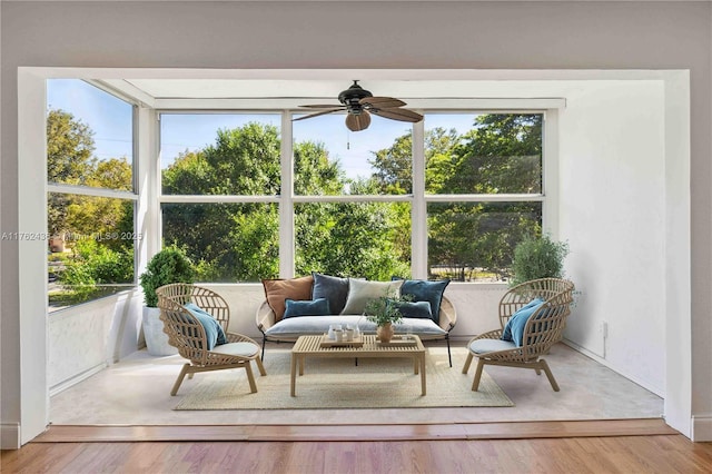 sunroom featuring a ceiling fan