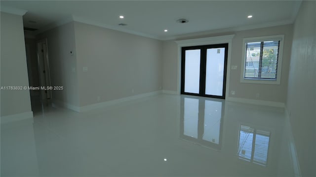 spare room with visible vents, recessed lighting, baseboards, and ornamental molding