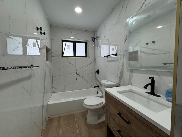 bathroom featuring vanity, toilet, shower / washtub combination, and wood tiled floor