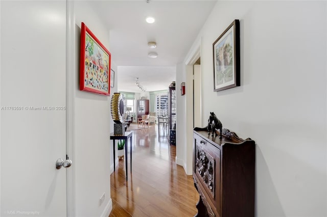 hallway with recessed lighting and light wood finished floors