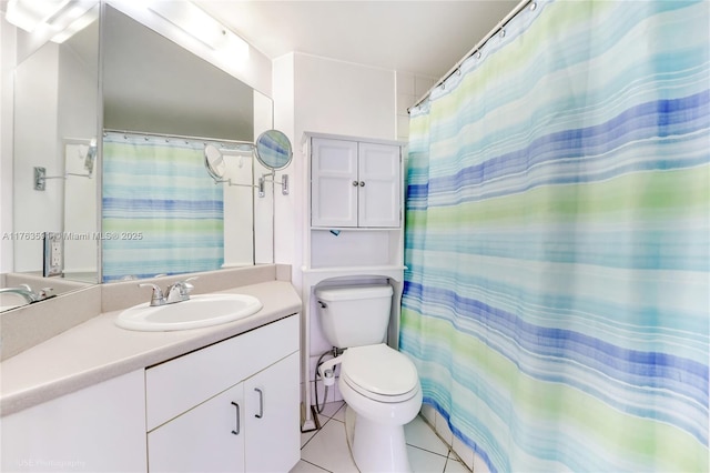 bathroom with a shower with curtain, toilet, vanity, and tile patterned flooring