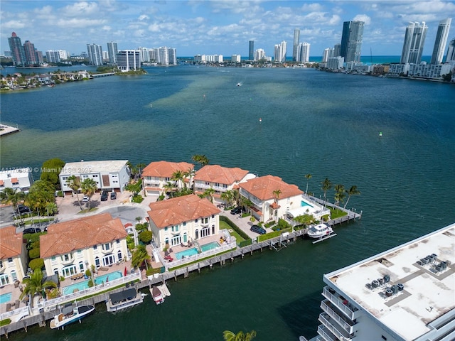 aerial view featuring a water view and a city view