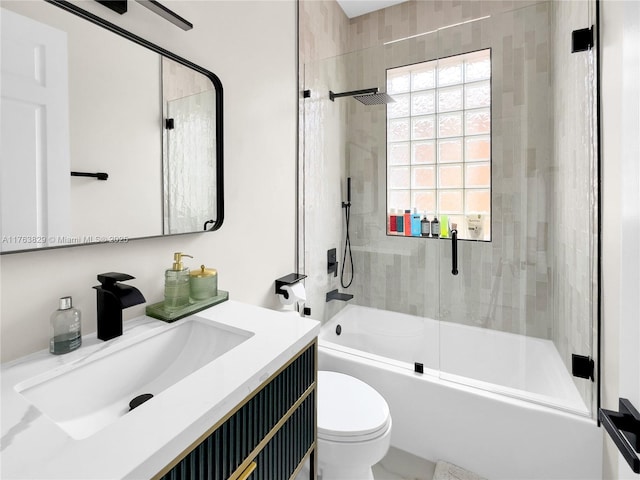 full bath featuring vanity, toilet, and washtub / shower combination