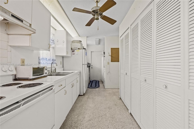 kitchen with a ceiling fan, a sink, light speckled floor, white appliances, and light countertops