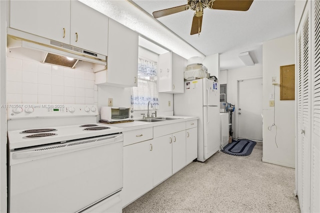 kitchen featuring white appliances, ceiling fan, a sink, light countertops, and under cabinet range hood